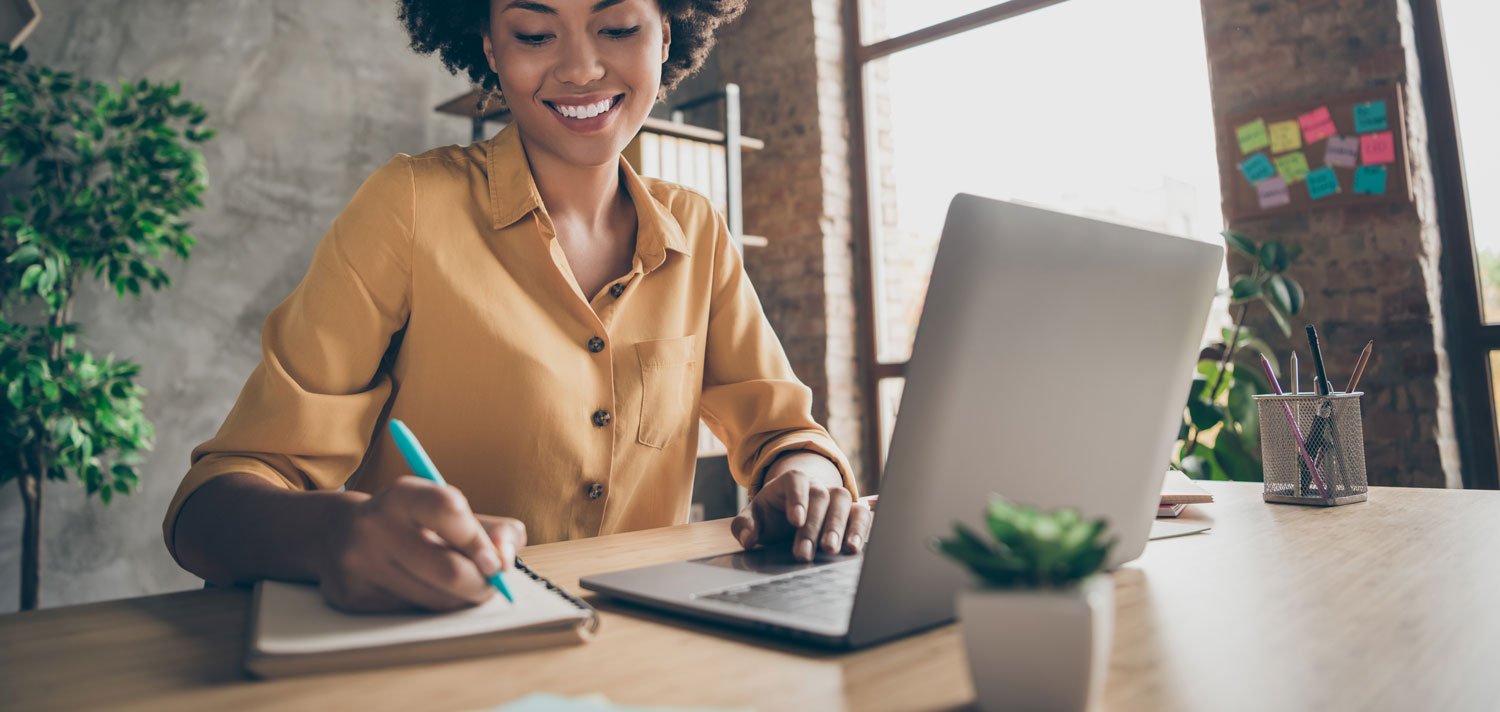 Woman writing at a desk
